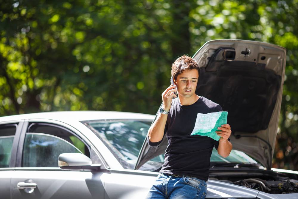 Person looking through his insurance paperwork