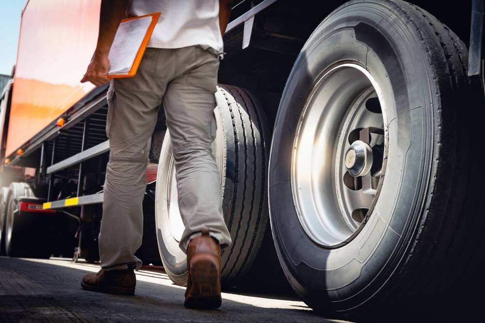 Man Walking Next to Truck