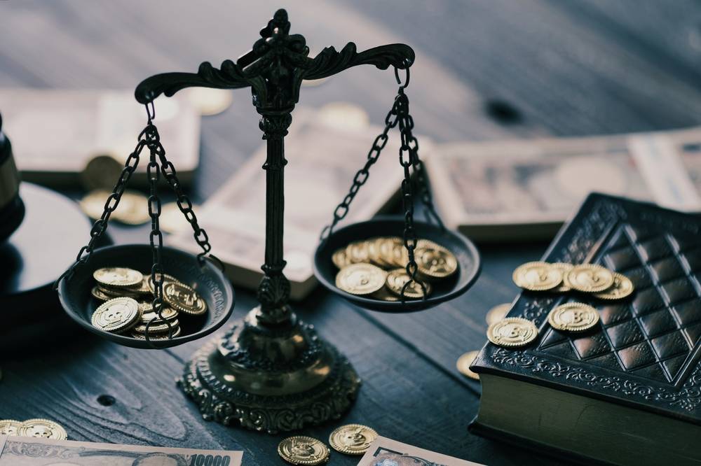 Photo of scales with money
