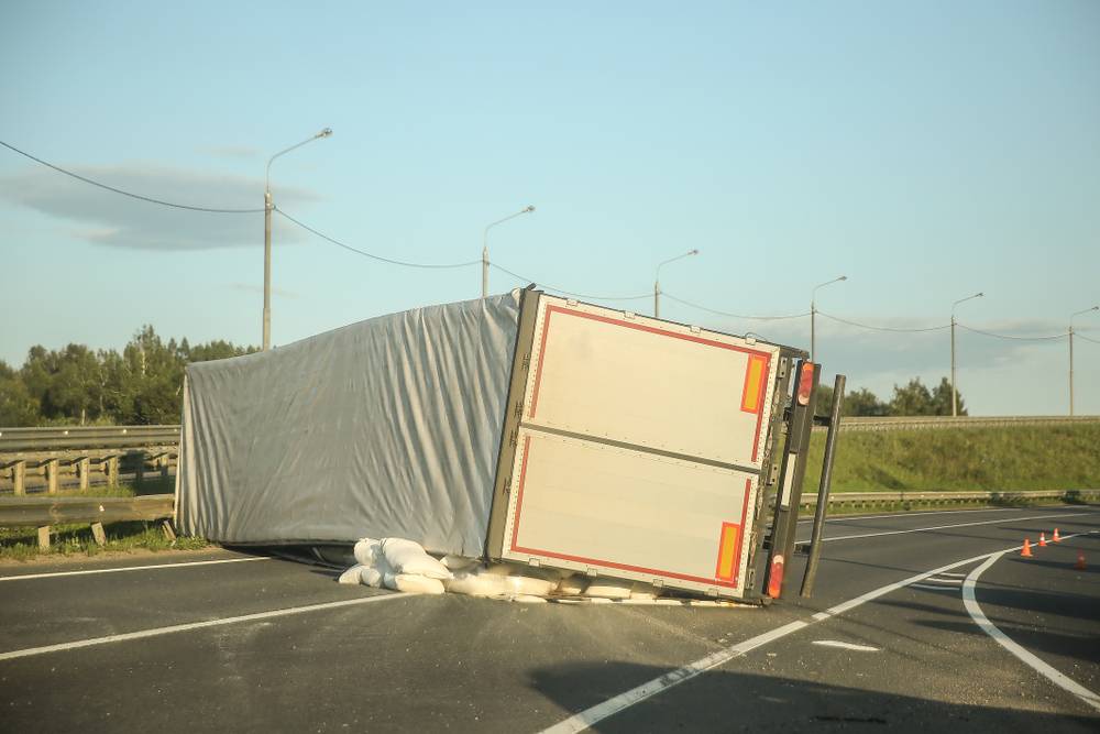 Photo of truck on side