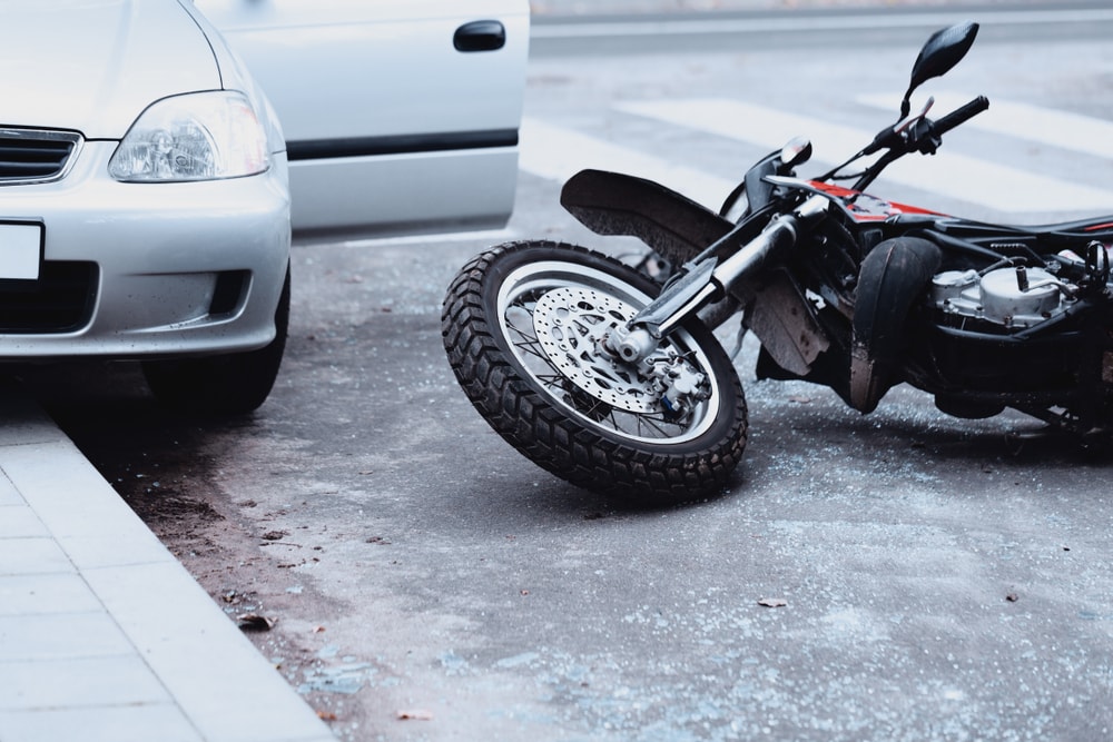 Closeup of aftermath after motorcycle car crash accident