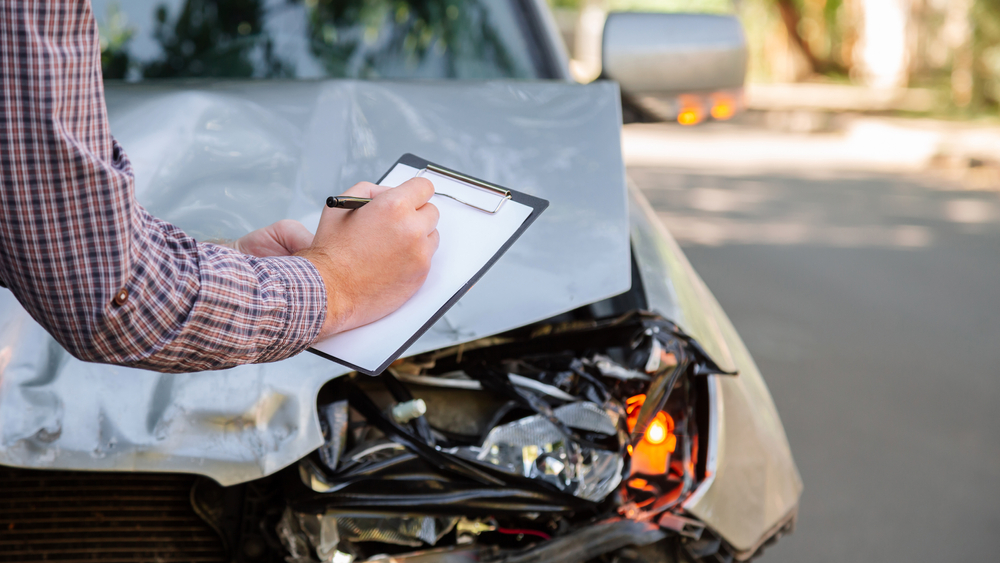 Photo of Insurance Agent taking notes