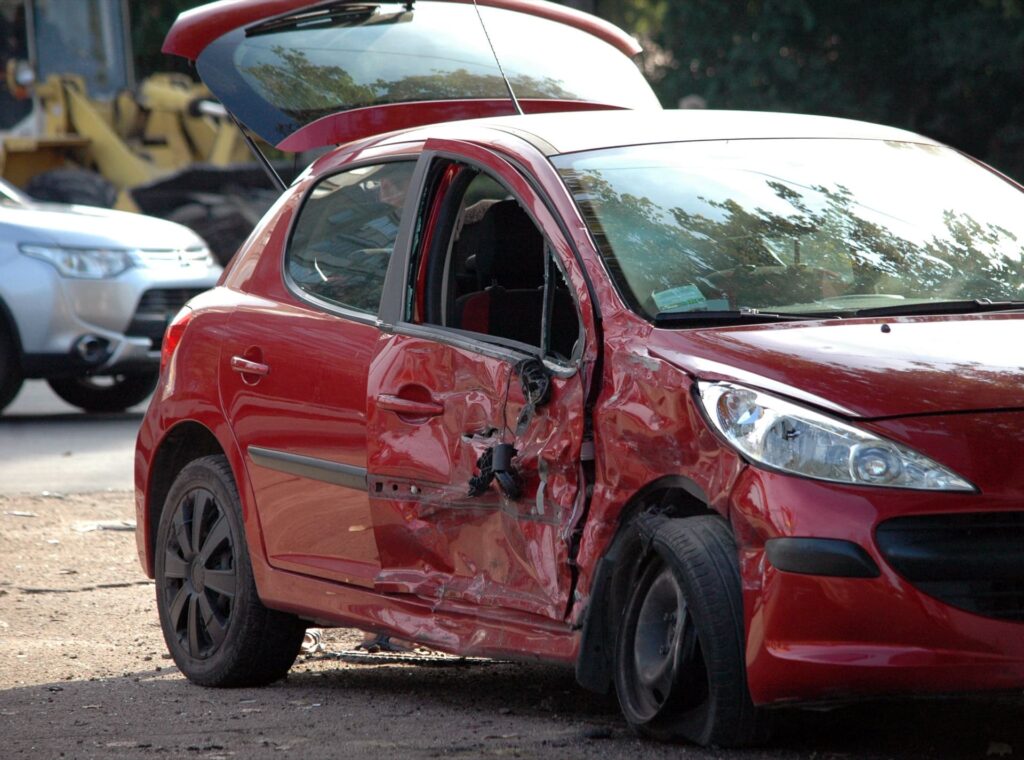 Photo of crashed red car