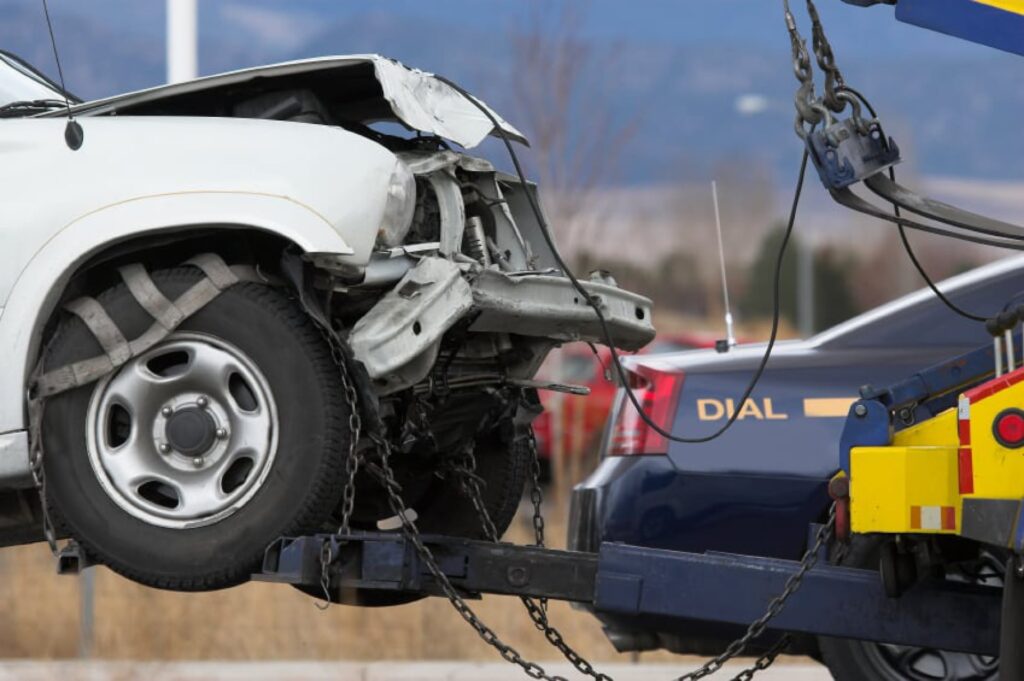 Crashed car is getting towed away