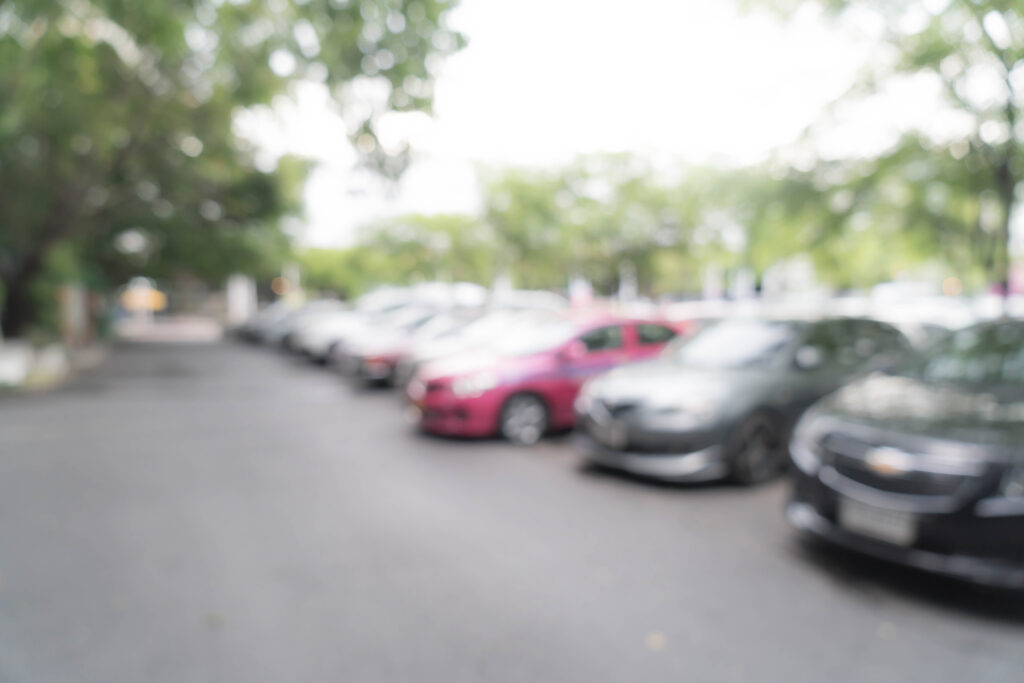 abstract blurred parked cars in parking lot