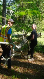Karis speaking with a city employee about clean up efforts in Cleveland Park